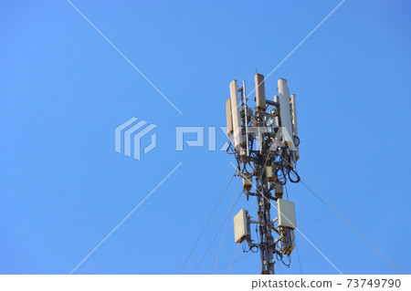 Telecommunication tower of 4G and 5G cellular. Wireless Communication Antenna Transmitter. Telecommunication tower with antennas . Telecommunication tower of 4G and 5G cellular. Wireless Communication Antenna Transmitter. Telecommunication tower with antennas . 73749790