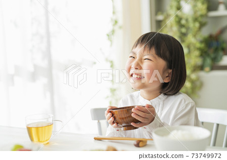 A girl who eats breakfast A girl who eats breakfast 73749972