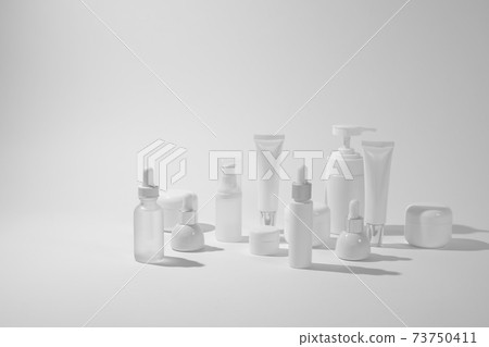 cosmetic and skin care package on white background with shadow. modern and minimal beauty product design. cosmetic and skin care package on white background with shadow. modern and minimal beauty product design. 73750411