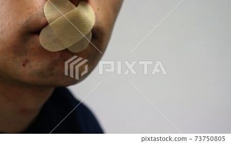 Close-up of a person with a tight mouth 73750805