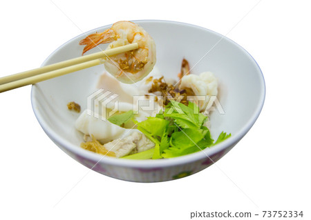 Boiled squid, shrimp and fish dip with sauce and vegetable 73752334
