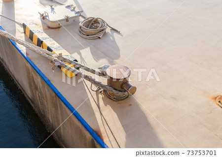 Bollard with mooring rope connected Bollard with mooring rope connected 73753701