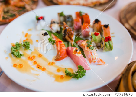 delicious sushi rolls set in a variety of japanese food delicious sushi rolls set in a variety of japanese food 73756676