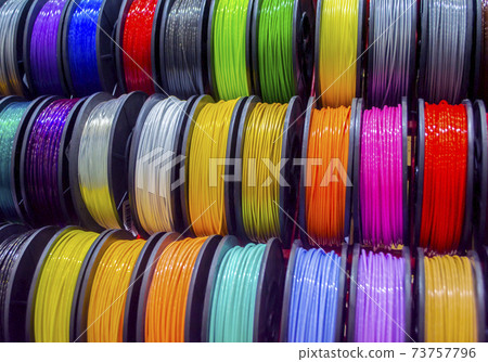 Multicolored filaments of plastic for printing on 3D printer close-up Multicolored filaments of plastic for printing on 3D printer close-up 73757796