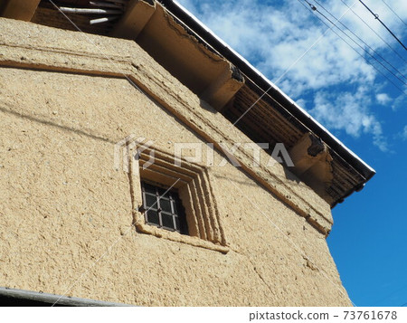 Old warehouse and its clay wall 73761678