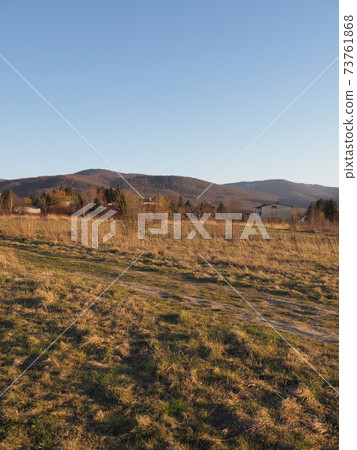 Calm Beskid Mountains in Bielsko-Biala, Poland at sun set - vertical 73761868