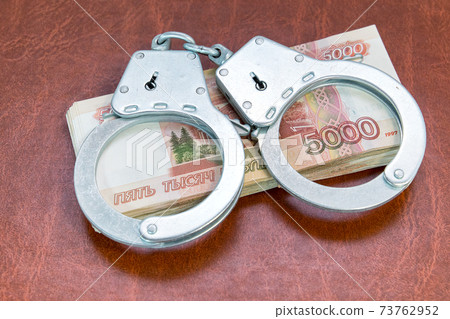 Handcuffs and money. Criminal punishment for corruption Handcuffs and money. Criminal punishment for corruption 73762952