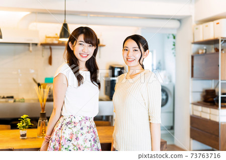 Female friends room share lifestyle casual 73763716