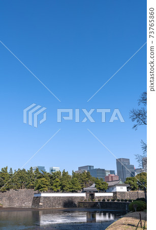 View of Tokyo cityscape in Japan, Marunouchi shining in the blue sky, Otemachi office district, Sakuradamon, etc. 73765860