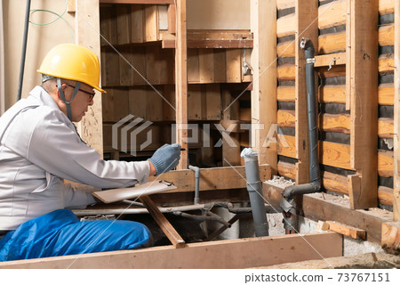 Residential remodeling skeleton remodeling businessman investigating bathroom demolition site Residential remodeling skeleton remodeling businessman investigating bathroom demolition site 73767151
