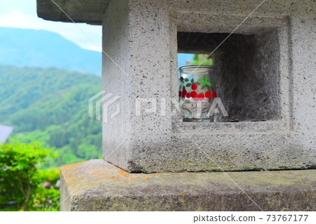 Lanterns and empty bottles on the roadside of Yamadera 73767177