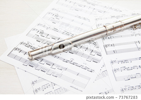 Sheet music and flute Sheet music and flute 73767283
