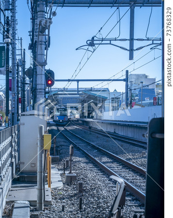 Stations on conventional lines seen from railroad crossings 73768329