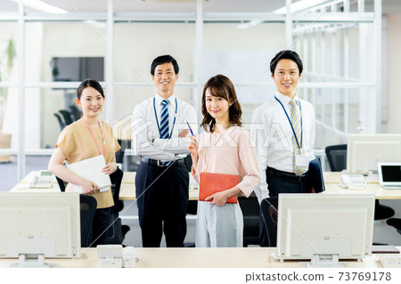 Business people lined up in the office Business people lined up in the office 73769178