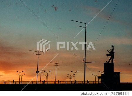 outside city sunset evening monument wires electricity outside city sunset evening monument wires electricity 73769384
