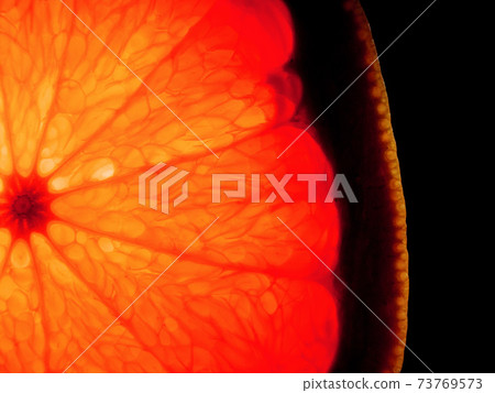 Organic grapefruit close-up on a black background. Organic grapefruit close-up on a black background. 73769573