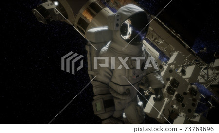 Astronaut outside the International Space Station on a spacewalk 73769696