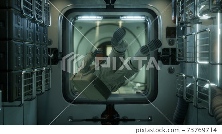 astronaut inside the orbital space station astronaut inside the orbital space station 73769714
