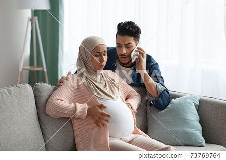 Worry Muslim Husband Calling Emergency While His Pregnant Wife Having Contractions Worry Muslim Husband Calling Emergency While His Pregnant Wife Having Contractions 73769764