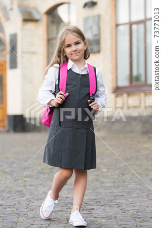 Little child in formal uniform dress go to school carrying bag, back to school Little child in formal uniform dress go to school carrying bag, back to school 73771013