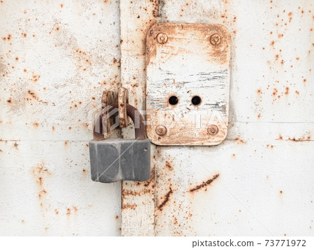 old lock on an iron door 73771972