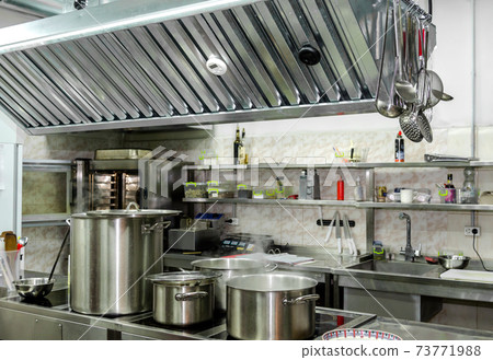 restaurant kitchen with dishes and pans without people 73771988