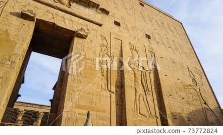 Entrance of Edfu temple of Horus majestic beautiful landmark with ancient blue paint on wall Entrance of Edfu temple of Horus majestic beautiful landmark with ancient blue paint on wall 73772824