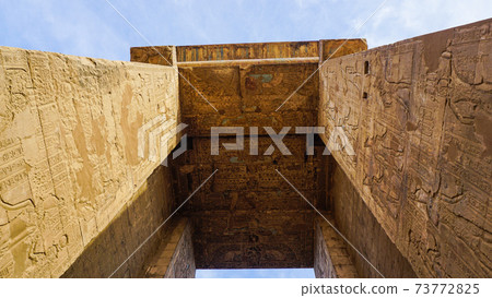 Entrance of Edfu temple of Horus majestic beautiful landmark with ancient blue paint on wall Entrance of Edfu temple of Horus majestic beautiful landmark with ancient blue paint on wall 73772825