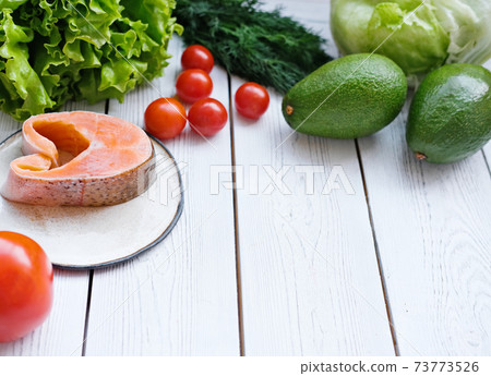 healthy meal tomatoes, fish, greens and avocado. healthy meal tomatoes, fish, greens and avocado. 73773526
