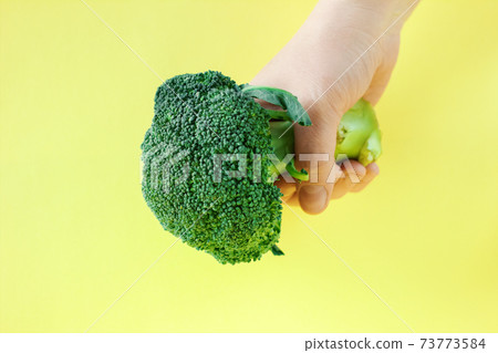 woman holding broccoli. healthy eating concept. weight loss and dieting woman holding broccoli. healthy eating concept. weight loss and dieting 73773584