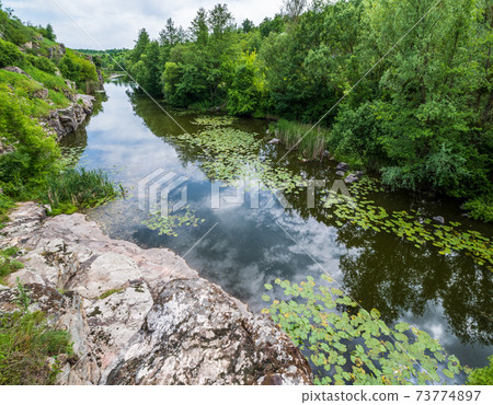 Buky Canyon summer landscape, Hirskyi Tikych river, Cherkasy Region, Ukraine. 73774897