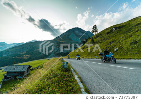 Motorbiker riding in Austrian Alps 73775397