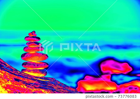 Stones pyramid on sand symbolizing zen, harmony, balance 73776083