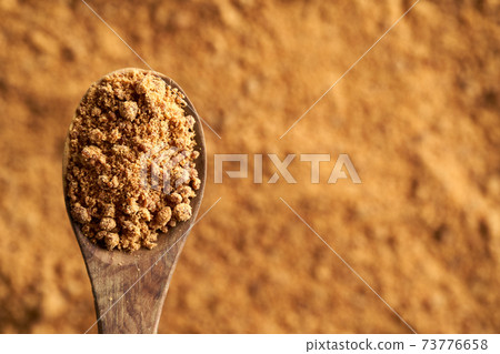 Panela or rapadura - healthy sweetener made by evaporating sugercane juice, top view with copy space Panela or rapadura - healthy sweetener made by evaporating sugercane juice, top view with copy space 73776658