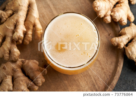 Probiotic drink with ginger on a table, top view Probiotic drink with ginger on a table, top view 73776864