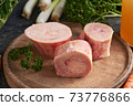 Ingredients for preparing beef bone broth or soup - fresh marrow bones and vegetables 73776866