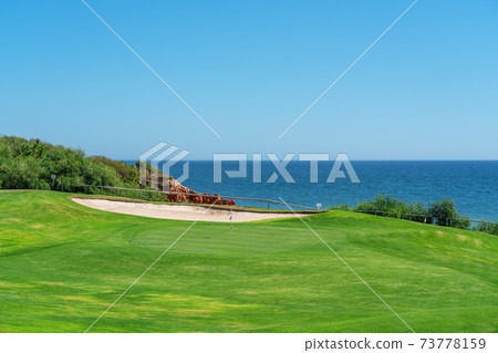 Resort luxury beaches, golf courses with palm trees, overlooking the sea for tourists to relax. Portugal algarve 73778159