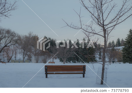 Bench in the snow Bench in the snow 73778793