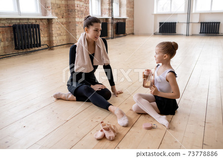 Ballerinas discussing their dance Ballerinas discussing their dance 73778886