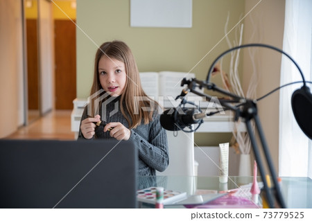 A young beauty blogger records online video content, live broadcasting of beauty products. 73779525