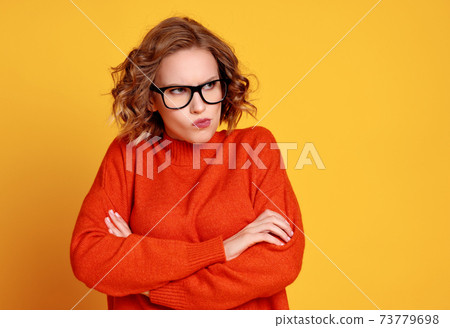 Offended young woman looking away Offended young woman looking away 73779698