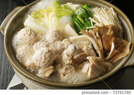 Warm hot pot with fish balls and chicken 73781780