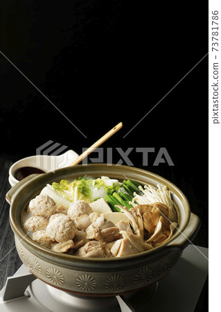 Warm hot pot with fish balls and chicken Warm hot pot with fish balls and chicken 73781786