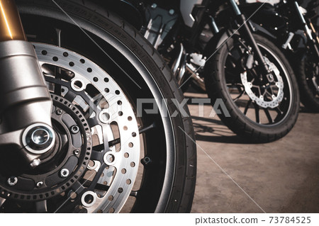Bike Touring Sunlight reflected on the front wheels of the bikes lined up in the bicycle parking lot a-3 Film-like warm colors Bike Touring Sunlight reflected on the front wheels of the bikes lined up in the bicycle parking lot a-3 Film-like warm colors 73784525
