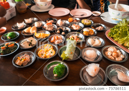 Dim sum Restaurant,Dim sum in small cups at a Chinese restaurant Dim sum Restaurant,Dim sum in small cups at a Chinese restaurant 73786511