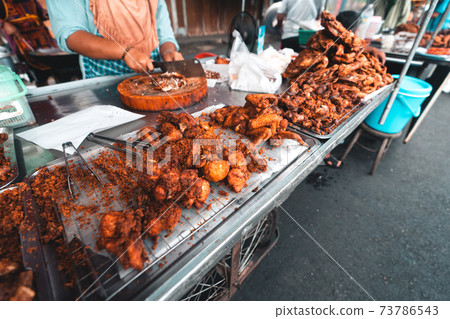 Fried Chicken and Sticky Rice in Thailand,Fried chicken at the market Fried Chicken and Sticky Rice in Thailand,Fried chicken at the market 73786543