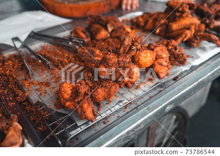 Fried Chicken and Sticky Rice in Thailand,Fried chicken at the market Fried Chicken and Sticky Rice in Thailand,Fried chicken at the market 73786544