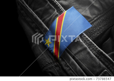 Tag on dark clothing in the form of the flag of the Democratic Republic of the Congo Tag on dark clothing in the form of the flag of the Democratic Republic of the Congo 73786547