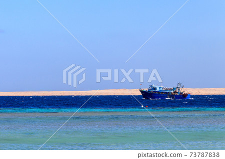 Fishing trawler sails at Red sea in Hurghada, Egypt Fishing trawler sails at Red sea in Hurghada, Egypt 73787838