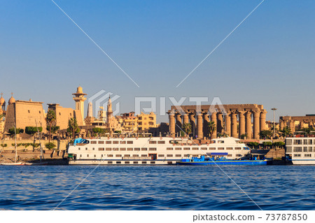Luxor Temple is a large Ancient Egyptian temple complex on east bank of Nile river in Luxor (ancient Thebes). View from Nile river Luxor Temple is a large Ancient Egyptian temple complex on east bank of Nile river in Luxor (ancient Thebes). View from Nile river 73787850